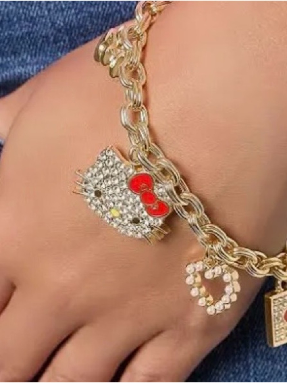 Hello Kitty Gold-Tone Bracelet with Red and Clear Accents